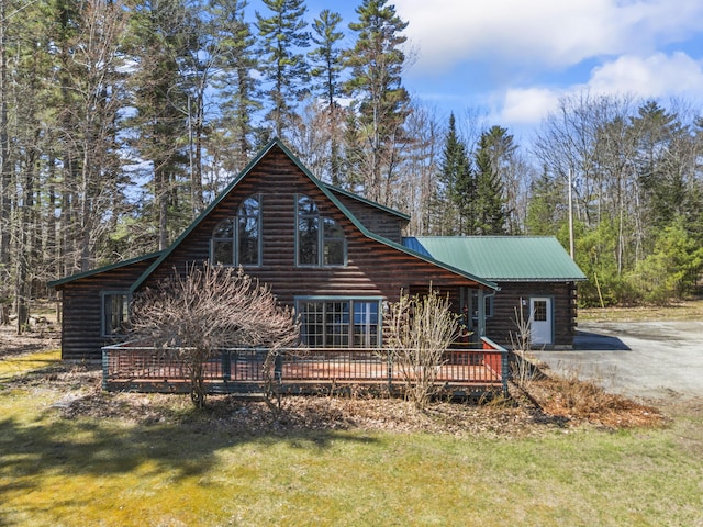 48 Thistle Ln, Sidney, ME 04330 - view of front of home with a wooden deck, metal roof, log exterior, and a front yard