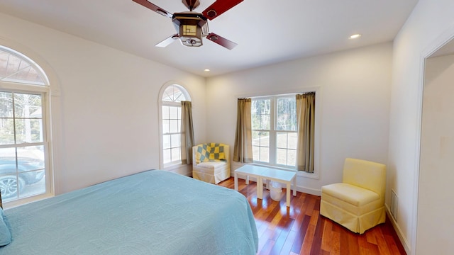 bedroom with baseboards, recessed lighting, wood finished floors, and ceiling fan