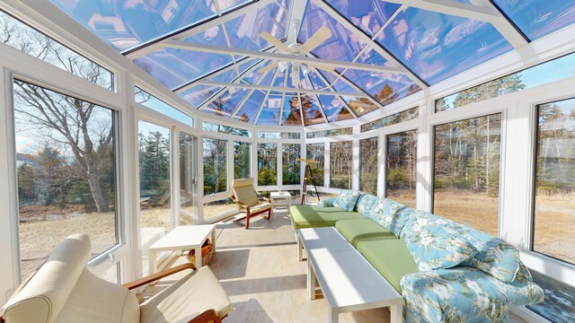 sunroom / solarium featuring an outdoor living space, a ceiling fan, and a wealth of natural light