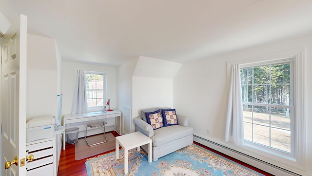 sitting room featuring wood finished floors and baseboard heating