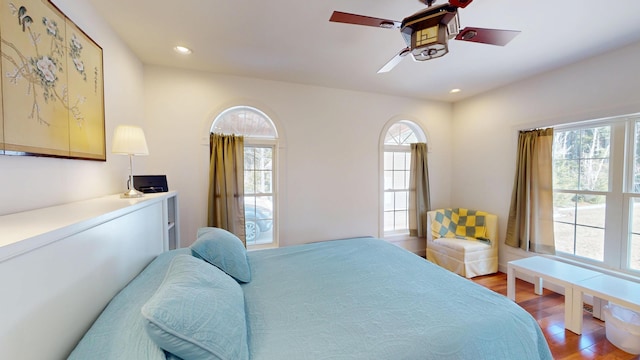 bedroom with recessed lighting, a ceiling fan, and light wood-style flooring