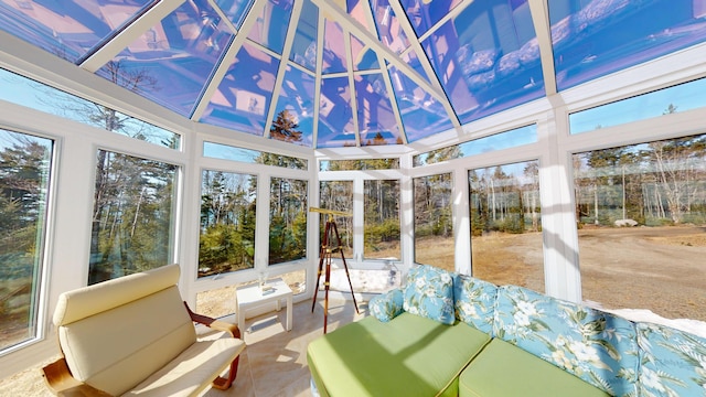 sunroom with a towering ceiling