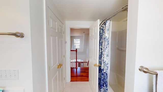 full bath featuring tile patterned floors and a shower with curtain