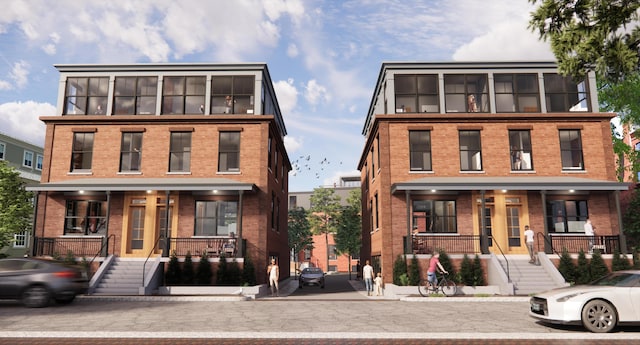 55 Carleton St Unit A, Portland, ME 04102 - townhome / multi-family property featuring a porch, brick siding, and stairway