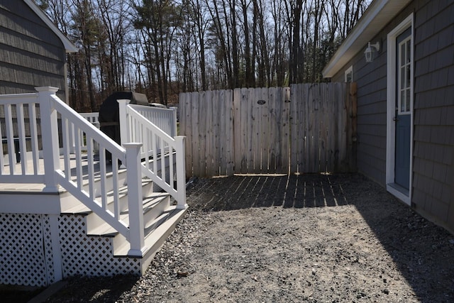 view of yard featuring stairway and fence