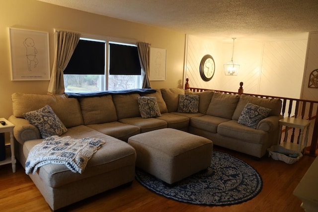 living room featuring a textured ceiling and wood finished floors