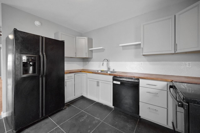 kitchen with a sink, black appliances, wooden counters, and open shelves