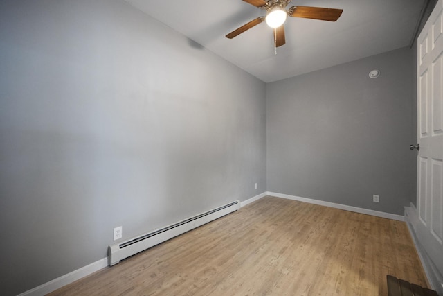 unfurnished room featuring wood finished floors, ceiling fan, baseboard heating, and baseboards