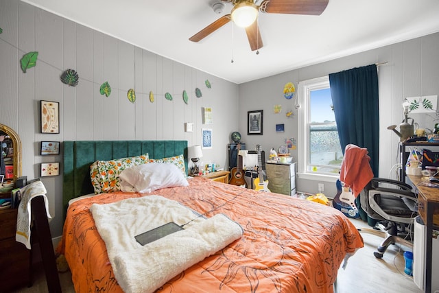bedroom with wood finished floors and a ceiling fan