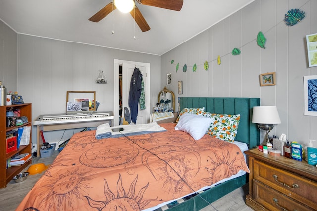 bedroom with wood finished floors and ceiling fan