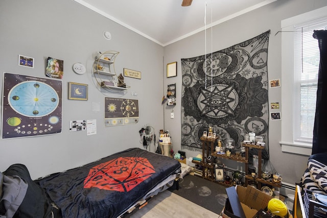 bedroom featuring ornamental molding and ceiling fan