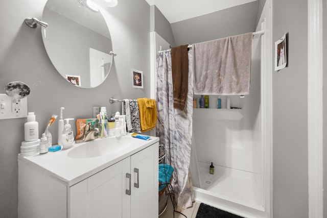 full bathroom with curtained shower and vanity