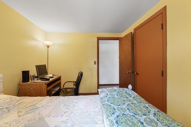 bedroom with carpet floors and baseboards