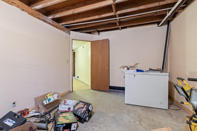 unfinished below grade area with fridge