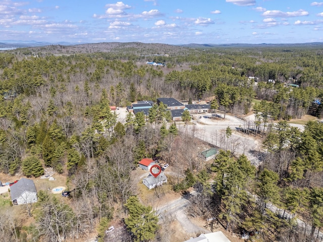 aerial view with a wooded view