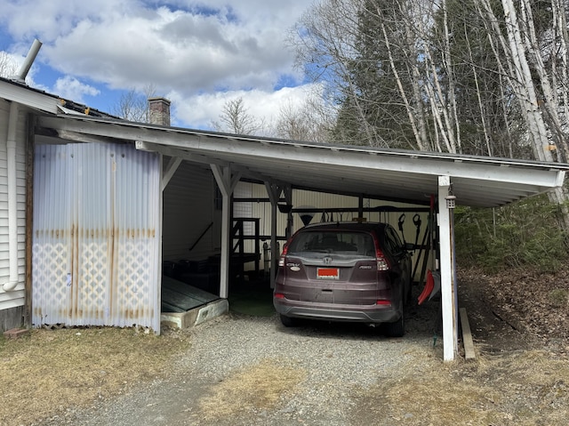 view of vehicle parking with a carport