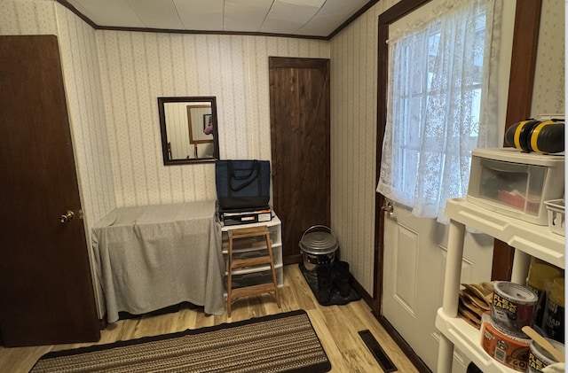 view of sauna / steam room with wallpapered walls and wood finished floors