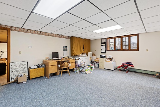 carpeted home office featuring a drop ceiling