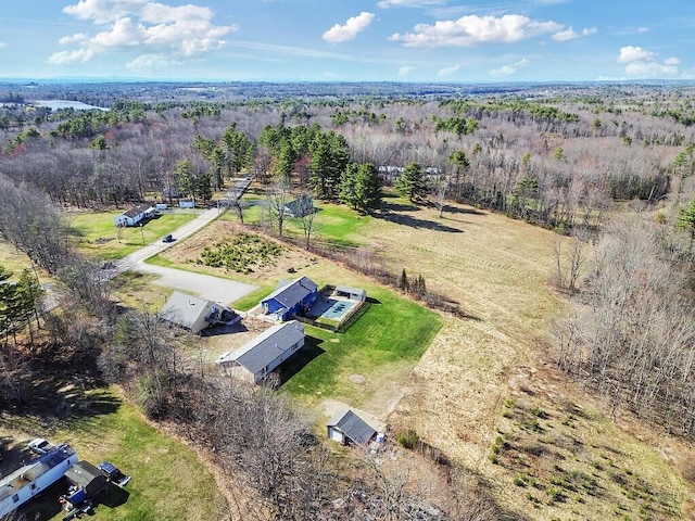 drone / aerial view featuring a view of trees