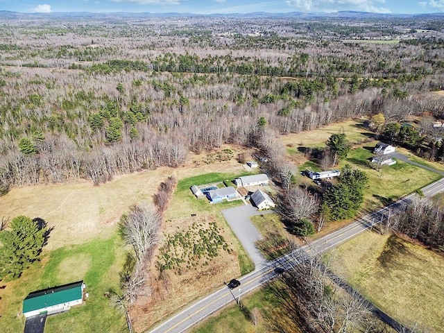 drone / aerial view featuring a forest view