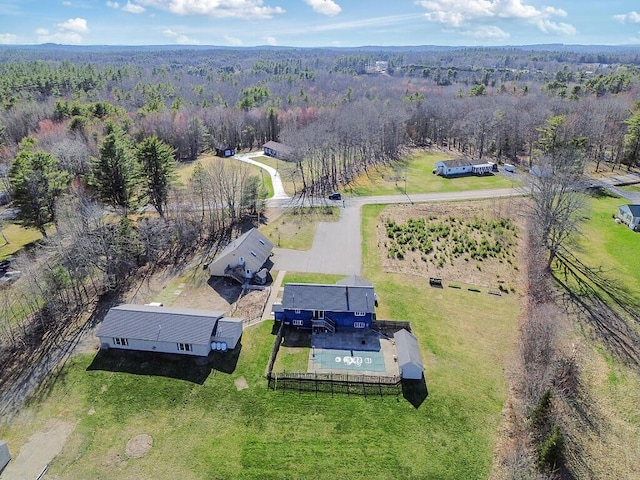aerial view featuring a wooded view