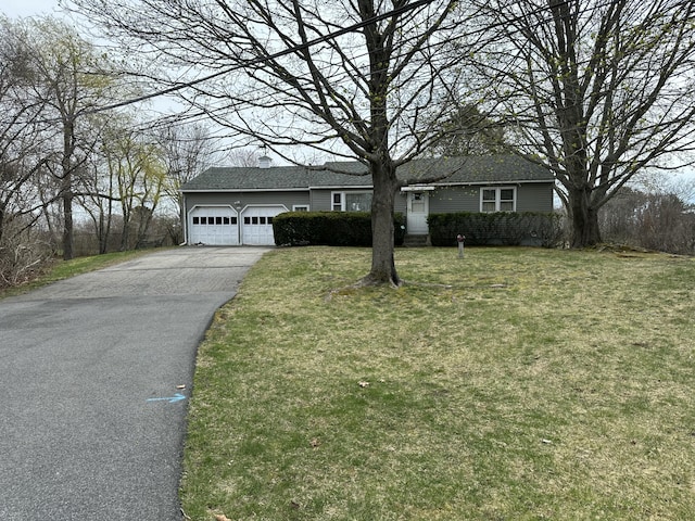 single story home with a front yard, roof with shingles, aphalt driveway, and an attached garage