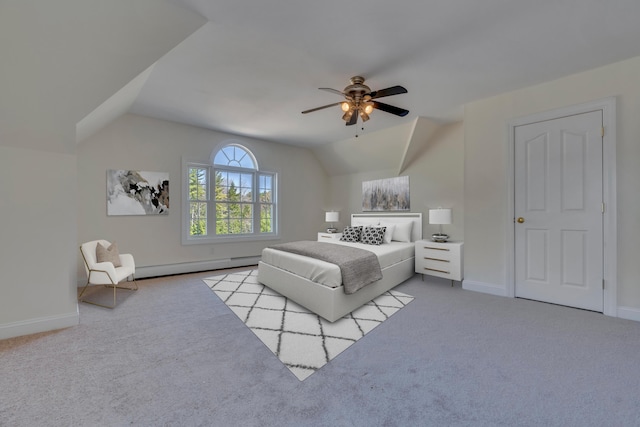 carpeted bedroom with lofted ceiling, ceiling fan, a baseboard heating unit, and baseboards