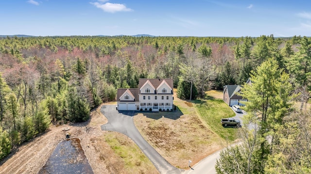 aerial view with a wooded view