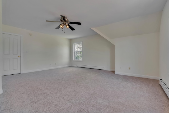 bonus room featuring a ceiling fan, baseboards, a baseboard heating unit, and light carpet