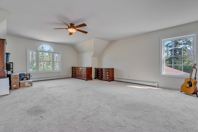 additional living space featuring a baseboard heating unit, carpet floors, ceiling fan, lofted ceiling, and a baseboard radiator