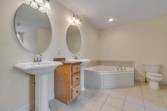 bathroom featuring baseboards, toilet, a garden tub, and tile patterned flooring