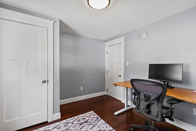 office featuring dark wood-type flooring and baseboards