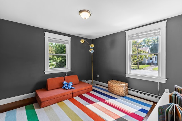 bedroom featuring baseboard heating and baseboards