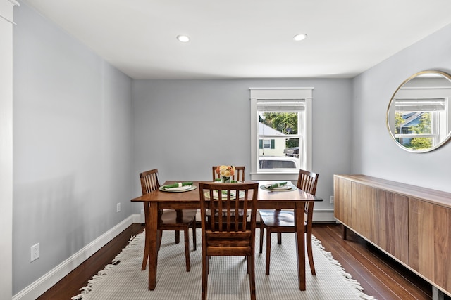 dining room featuring recessed lighting, baseboards, and dark wood-type flooring
