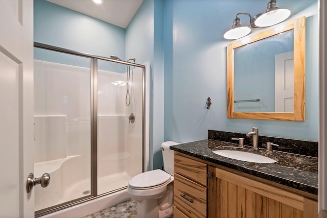 full bathroom with toilet, a shower stall, and vanity