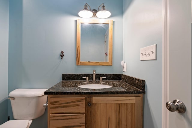 half bath with toilet and vanity