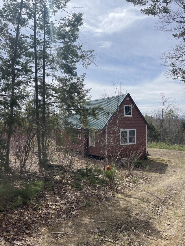 173 N Tamworth Rd, Otisfield, ME 04270 - view of home's exterior featuring metal roof