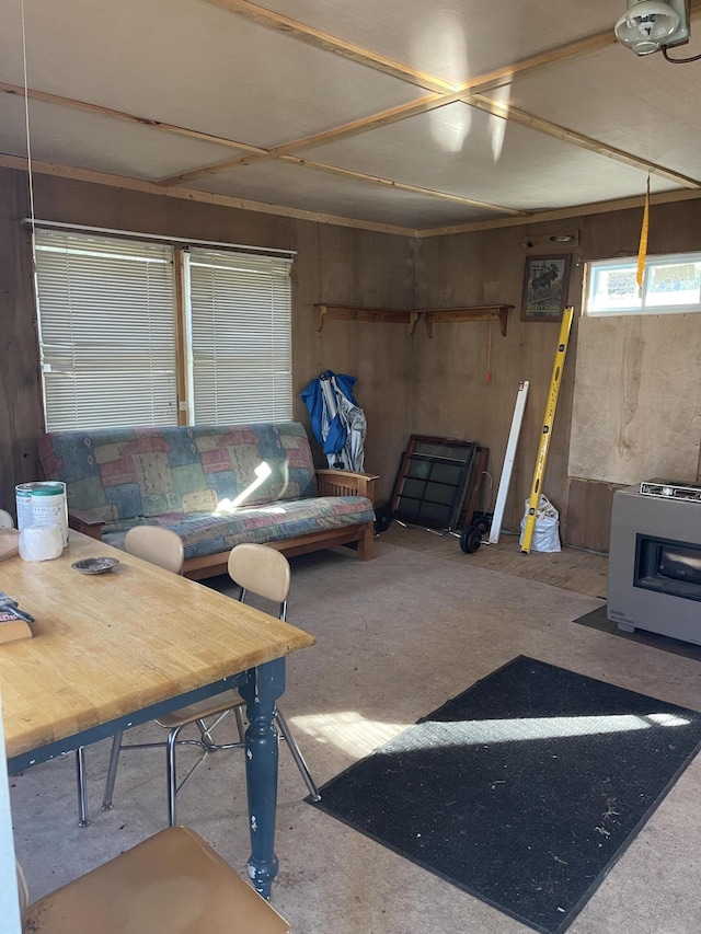 173 N Tamworth Rd, Otisfield, ME 04270 - living area featuring a wood stove, heating unit, and wood walls