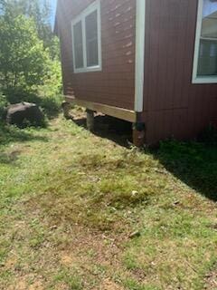 173 N Tamworth Rd, Otisfield, ME 04270 - view of property exterior featuring a lawn