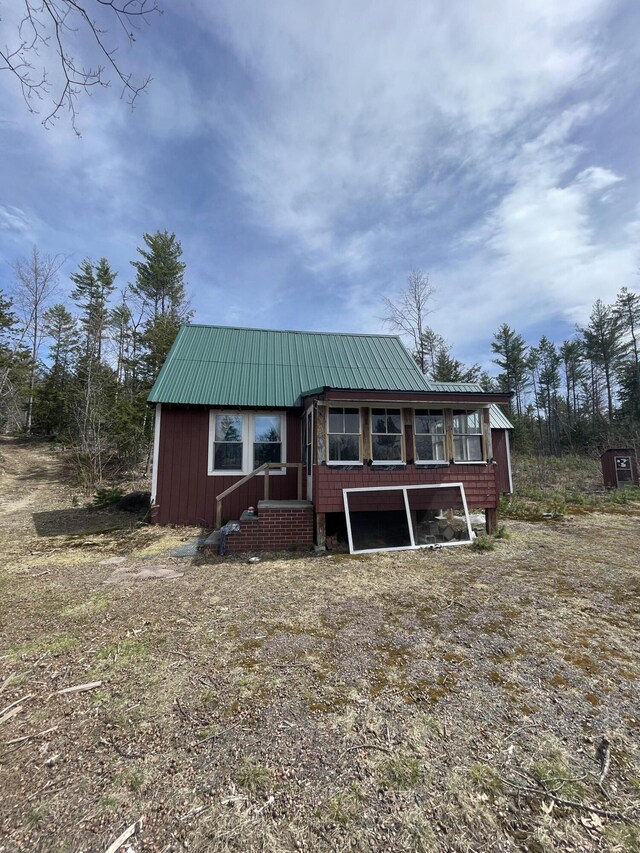 173 N Tamworth Rd, Otisfield, ME 04270 - view of front facade featuring metal roof