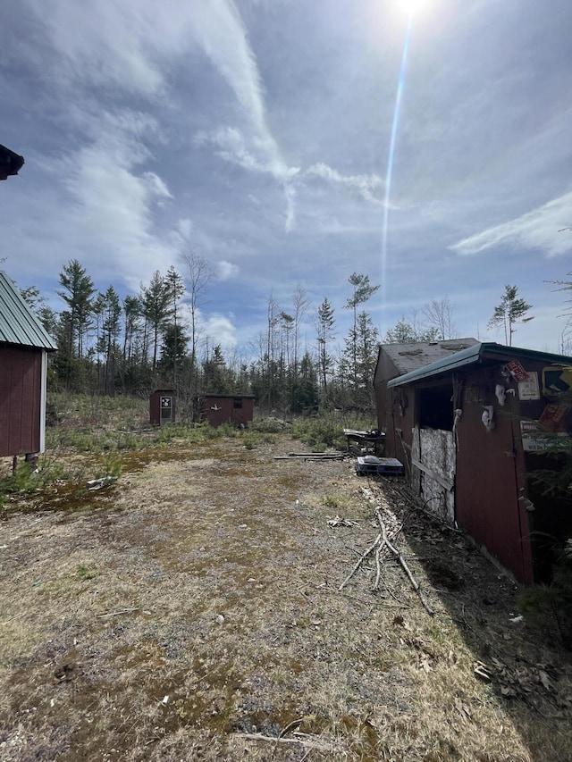 173 N Tamworth Rd, Otisfield, ME 04270 - view of yard featuring a shed and an outbuilding