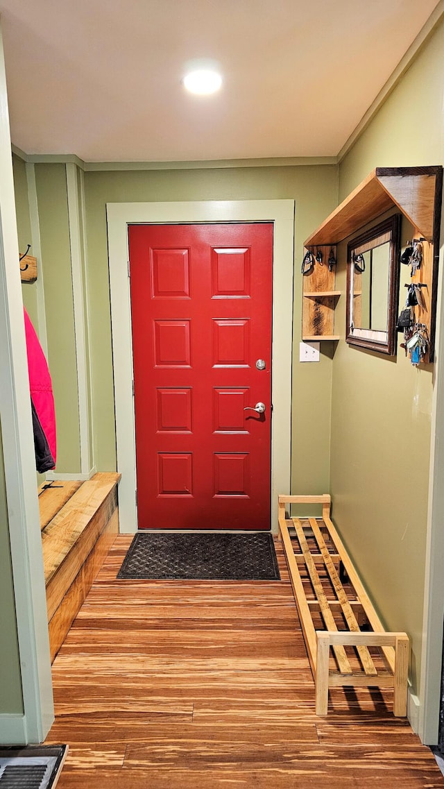 interior space featuring wood finished floors and recessed lighting