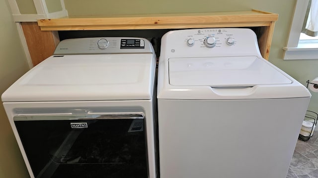 laundry area featuring laundry area and washing machine and dryer