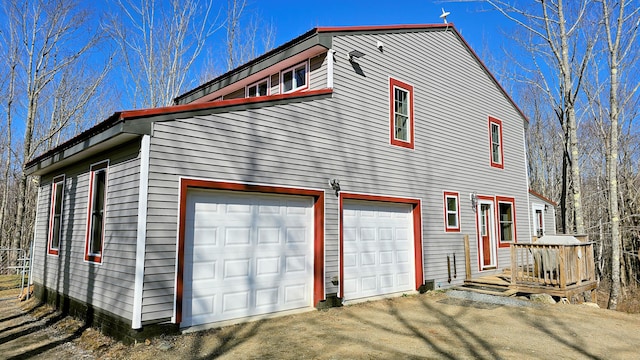 view of side of property with driveway