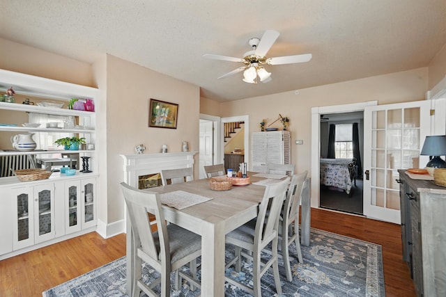 126 Elm St, Newport, ME 04953 - dining room with stairway, wood finished floors, and a ceiling fan