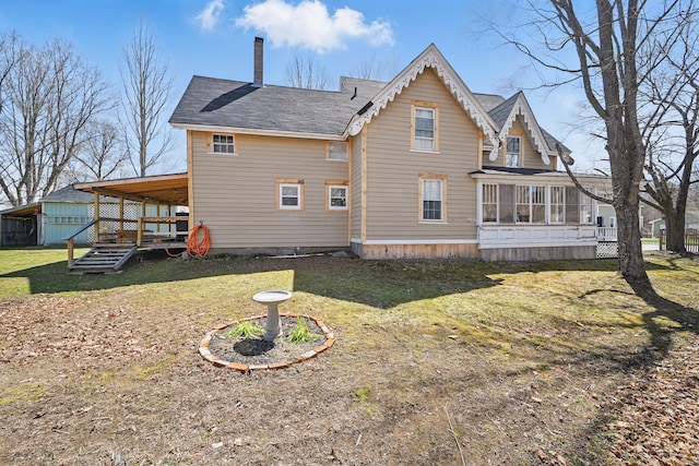 126 Elm St, Newport, ME 04953 - back of property featuring a chimney, a yard, a sunroom, and roof with shingles