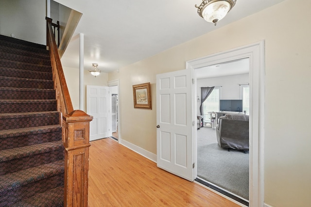 126 Elm St, Newport, ME 04953 - staircase with wood finished floors and baseboards