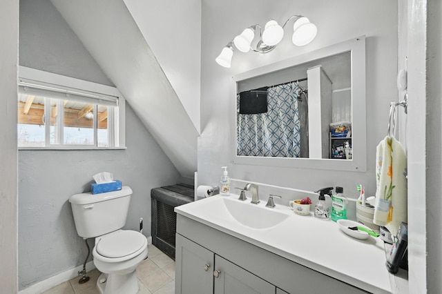 126 Elm St, Newport, ME 04953 - bathroom with tile patterned floors, toilet, vanity, and vaulted ceiling