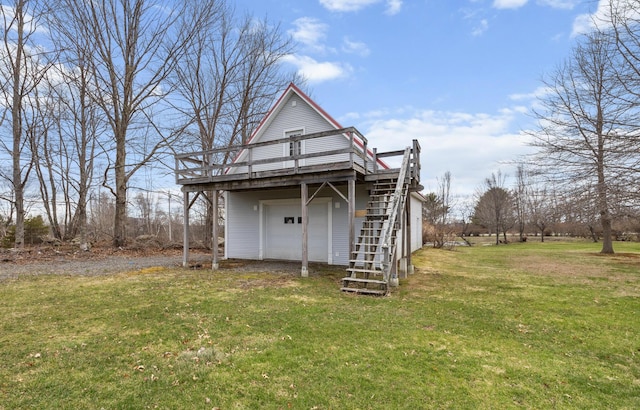 view of outbuilding featuring stairway
