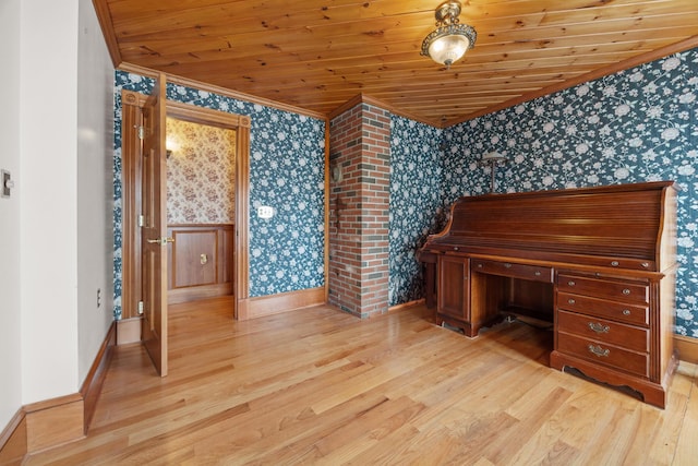 interior space with baseboards, ornamental molding, light wood-style flooring, and wallpapered walls